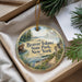 A round ornament with a scenic image of Beaver Island State Park, New York, hanging from a string.