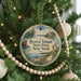 A round ornament hanging on a Christmas tree, featuring a scenic image of Beaver Island State Park, New York.