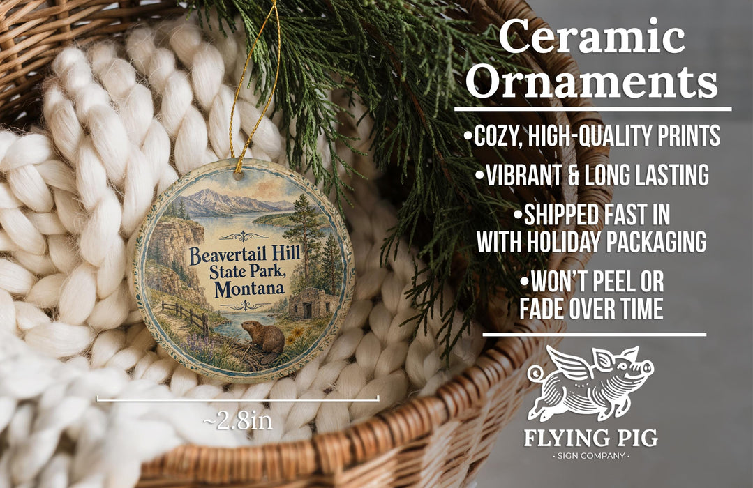 Ceramic ornaments, featuring a Beavertail Hill State Park, Montana ornament, are displayed in a woven basket.
