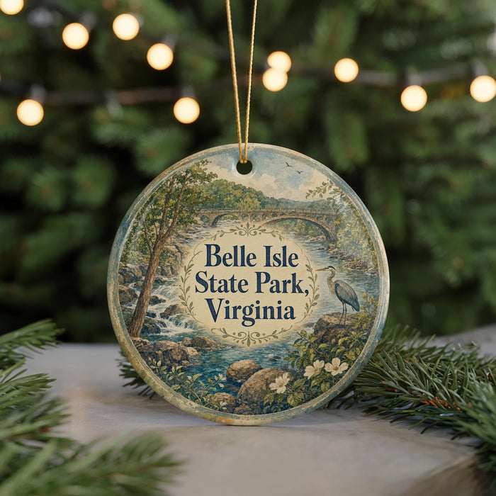 A round ornament with a scenic landscape of Belle Isle State Park, Virginia, featuring a bird, trees, and water.