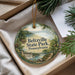 A round ornament with a scenic landscape of Beltzville State Park, Pennsylvania, hanging from a string.