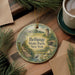 A round ornament with a scenic landscape of Bethpage State Park, New York, featuring a bird, a bridge, and a pond.