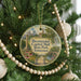 A circular ornament hanging on a Christmas tree, featuring an illustration of Capitol Mall in Tennessee.