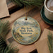 A decorative ornament with a scenic landscape of Big Arm State Park, Montana, featuring a cabin, mountains, and a lake.