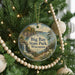 A circular ornament hanging on a Christmas tree, featuring a scenic landscape of Big Bay State Park in Wisconsin.