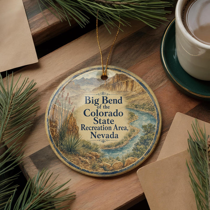 A decorative ornament featuring a scenic image of the Big Bend of the Colorado State Recreation Area in Nevada, with a cup of coffee and pine branches nearby.