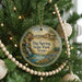 A round ornament hanging on a Christmas tree, featuring a scenic image of Big Spring State Park, Texas.