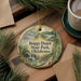 A decorative ornament with a scenic image of Boggy Depot State Park, Oklahoma, hanging on a wooden surface.