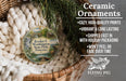 Ceramic ornaments, featuring a detailed image of a scenic landscape with a river, bridge, and houses, are displayed in a woven basket.