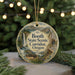 A round ornament with a scenic image of the Booth State Scenic Corridor, Oregon, hanging from a string.