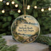 A circular ornament with a scenic beach landscape and text that reads "Bullards Beach State Park, Oregon" is displayed in front of a blurred background of Christmas lights.
