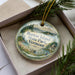 A decorative ornament with a scenic landscape of Vermont State Park, featuring a house, trees, and a body of water.