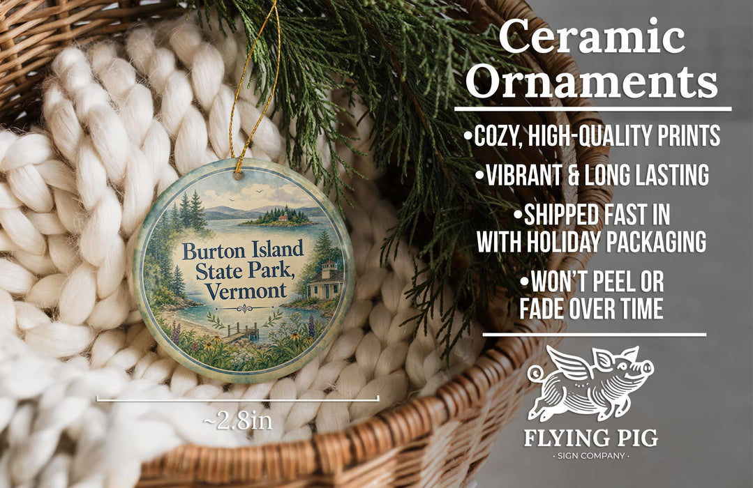 Ceramic ornaments, specifically a round ornament with a scenic view of Vermont State Park, are displayed in a woven basket.