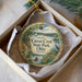 A decorative ornament in a box, featuring a scenic image of Caesar Creek State Park in Ohio.