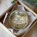 A decorative ornament in a box, featuring a scenic landscape with a deer and a river, along with the text "Calamus State Recreation Area, Nebraska".