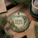 A decorative ornament featuring a scenic landscape of Caledonia State Park, Pennsylvania, with a waterfall and pine trees.