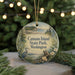 A round ornament with a scenic image of Camano Island State Park, Washington, featuring a heron, a tree, and a body of water.