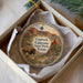 A decorative ornament in a box, featuring a scenic image of Caprock Canyon State Park, Texas.