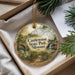 A decorative ornament with a scenic landscape of Castlewood State Park, Missouri, featuring a bridge, waterfall, and greenery.