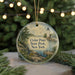 A round ornament featuring a lighthouse and a scenic landscape, with the text "Cedar Point State Park, New York" displayed prominently.