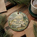 A decorative ornament with a scenic illustration of the Champoeg State Heritage Area in Oregon, featuring a wagon, a river, and pine trees.