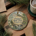 A decorative ornament featuring a scenic image of Chapman State Park in Pennsylvania, surrounded by pine branches and a cup of coffee on a wooden surface.