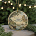 A round ornament with a painting of a ship and a castle, surrounded by greenery, with the text "Charles Towne Landing State Historic Site, South Carolina" displayed on it.