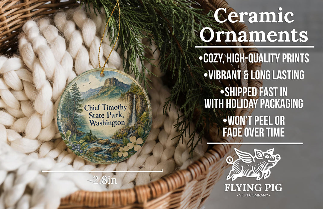Ceramic ornaments, featuring a scenic landscape with a mountain and a river, are displayed in a woven basket.