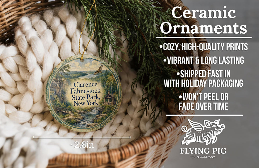 Ceramic ornaments, featuring a round ornament with a scenic image of Clarence Fahnestock State Park, New York, hanging from a wicker basket.