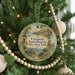 A round ornament hanging on a Christmas tree, featuring an illustration of Clermont State Historic Site in New York.