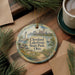 A decorative ornament featuring a scenic view of Cleveland Lakefront State Park, Ohio, with a lighthouse and a sailboat in the background.