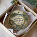 A round ornament with a scenic image of Codorus State Park, Pennsylvania, hanging from a string.