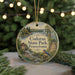 A round ornament with a scenic image of Codorus State Park, Pennsylvania, featuring a bird, a house, and a river.