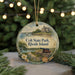 A decorative ornament featuring a scenic image of a coastal landscape with a castle, boats, and a lighthouse, along with the text "Colt State Park, Rhode Island".