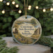 A round ornament with a scenic image of a wagon and a cabin in the Conestoga State Recreation Area, Nebraska, surrounded by greenery and twinkling lights.