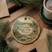 A decorative ornament featuring a scenic landscape of Crowder State Park in Missouri, with a lighthouse in the background.
