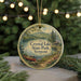 A round ornament with a scenic image of Crystal Lake State Park, Vermont, featuring a canoe on the lake and a cabin in the background.
