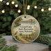 A round ornament with a scenic landscape depicting Crystal Lake State Recreation Area, Nebraska, featuring a bird, a boat, and a path.