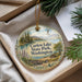 A decorative ornament with a scenic landscape of Curlew Lake State Park, Washington, featuring a lake, mountains, pine trees, and a bird in flight.