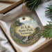 A decorative ornament with a scenic landscape of D.A.R. State Park in Vermont, featuring a waterfall and a castle.