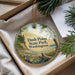 A decorative ornament with a scenic landscape of Dash Point State Park in Washington, featuring a beach, mountains, and pine trees.