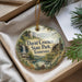 A decorative ornament with a scenic landscape of David Crockett State Park, Tennessee, displayed in a box with pine branches.