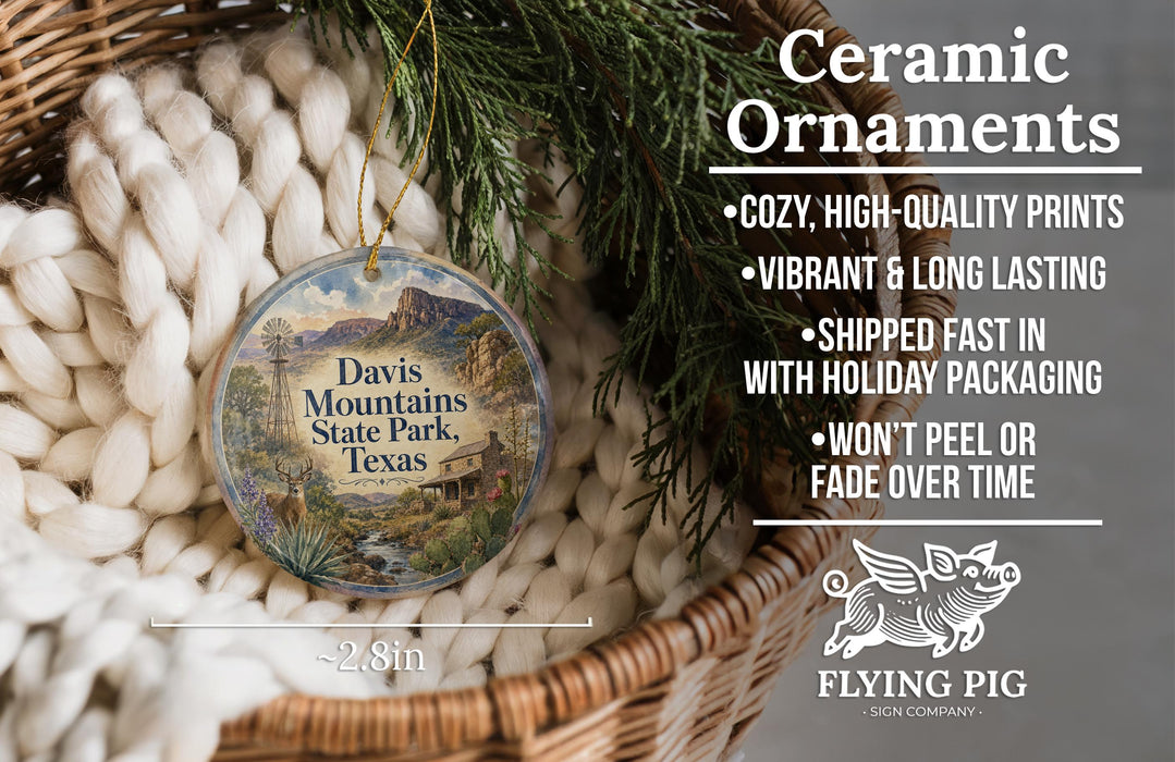 Ceramic ornaments, featuring a design of Davis Mountains State Park, Texas, hanging in a basket with pine branches.