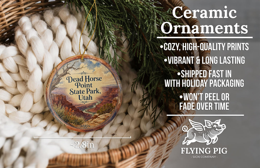 Ceramic ornaments, featuring a Dead Horse Point State Park ornament with a desert landscape, are displayed in a basket.