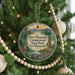A Christmas tree ornament featuring a deer standing in a forest, with the text "Deer Mountain Campground State Park, New Hampshire" displayed on it.