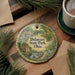 A decorative ornament featuring a scenic landscape of Delaware State Park, Ohio, with a bird in the foreground and pine branches surrounding it.