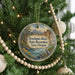 A round ornament hanging on a Christmas tree, featuring a scenic image of the Deschutes River State Recreation Area, Oregon.
