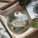 A decorative ornament with a scenic landscape of Detroit Lake, Michigan, surrounded by pine trees and other natural elements.