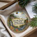 A decorative ornament with a scenic landscape of Dixville Notch State Park, New Hampshire, displayed in a box with pine branches.