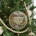 A round ornament on a Christmas tree, featuring a scenic image of East Canyon State Park, Utah.